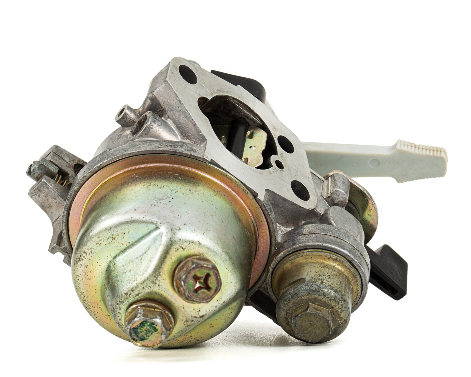 A mower carburetor with the float bowl removed, next to a can of carburetor cleaner